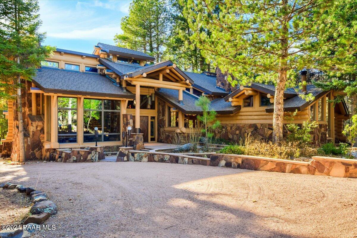 1804 Pyle Ranch Road Payson, AZ 85541 - Photo 1 of 113 a patio with a table and chairs under an umbrella