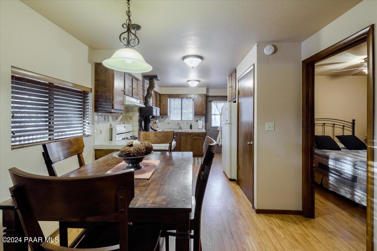1804 Pyle Ranch Road Payson, AZ 85541 - Photo 107 of 113 a view of a dining room with furniture window and wooden floor