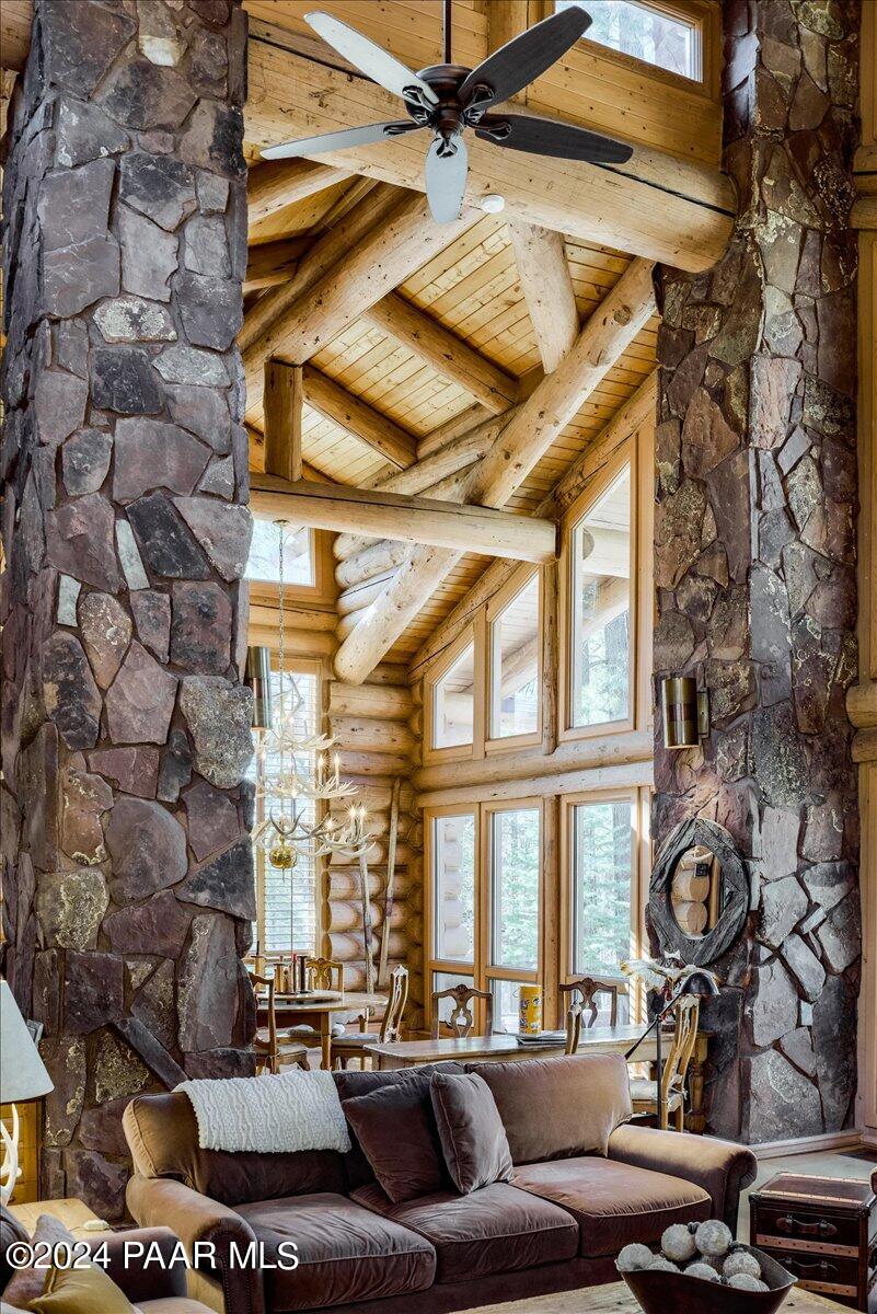 1804 Pyle Ranch Road Payson, AZ 85541 - Photo 34 of 113 a living room with couches a fireplace with a large window