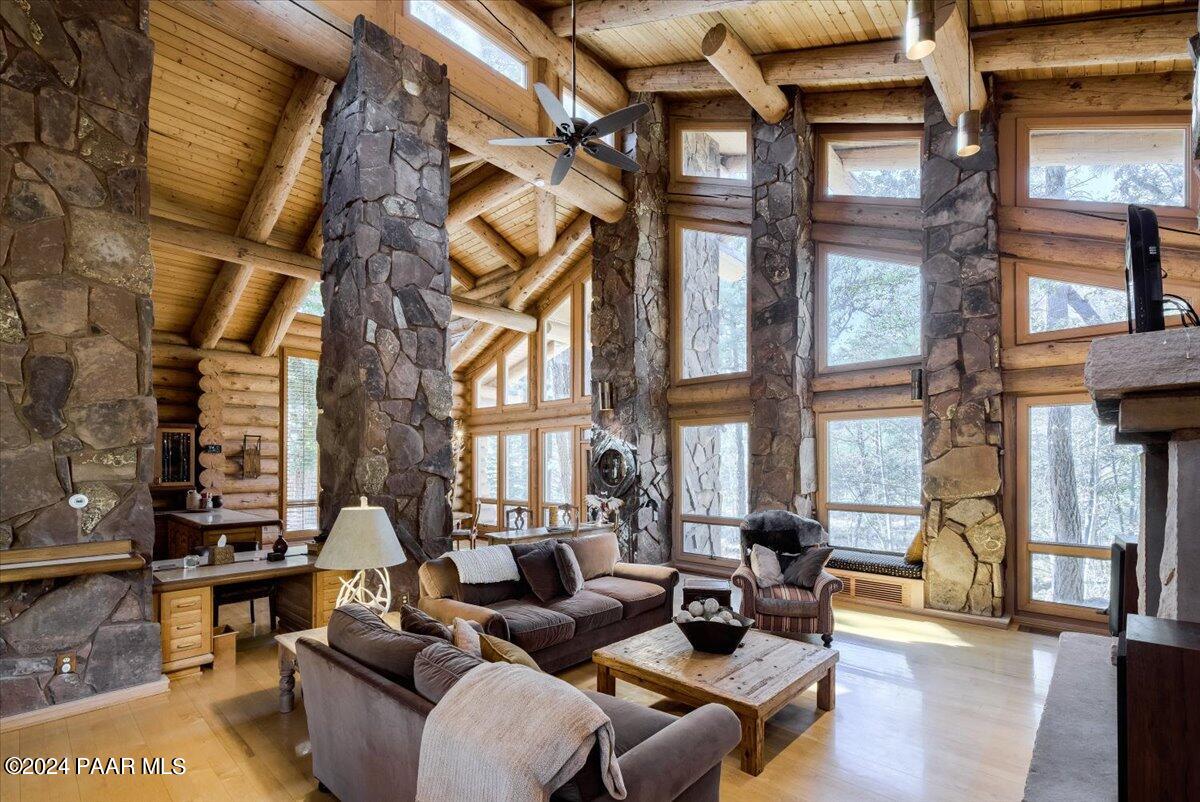 1804 Pyle Ranch Road Payson, AZ 85541 - Photo 40 of 113 a living room with furniture a lamp and a floor to ceiling window