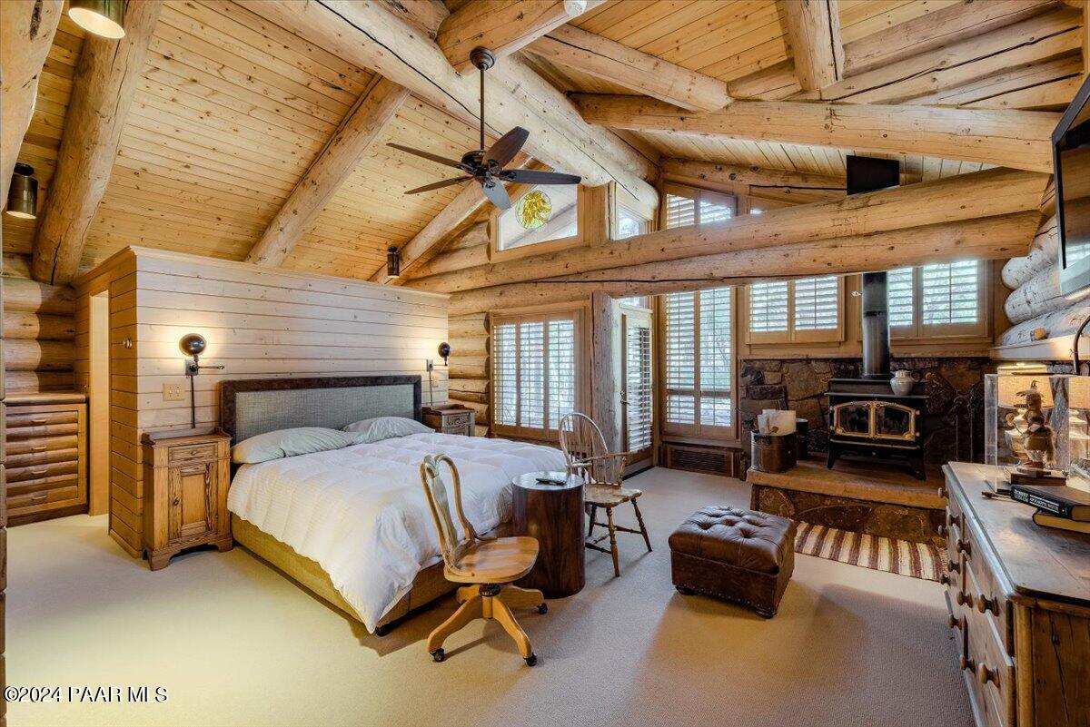 1804 Pyle Ranch Road Payson, AZ 85541 - Photo 53 of 113 a bedroom with a bed couch and a ceiling fan