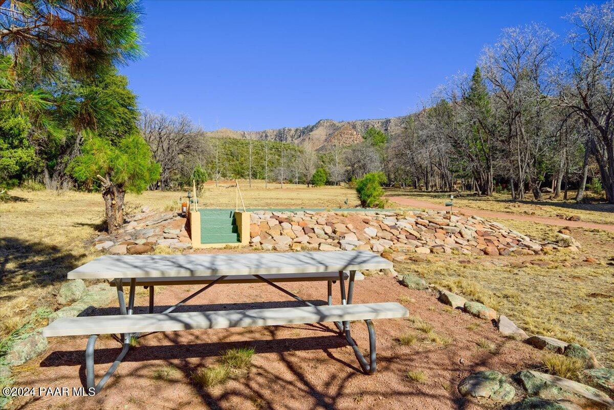 1804 Pyle Ranch Road Payson, AZ 85541 - Photo 9 of 113 a view of a lounge chair and table on the beach