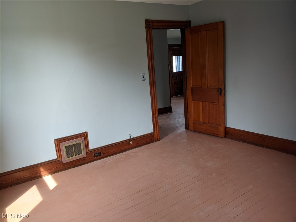 70 Center Road Bedford, OH 44146 - Photo 16 of 18 Empty room with dark hardwood / wood-style floors