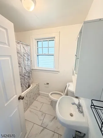 a bathroom with a sink and a bathtub