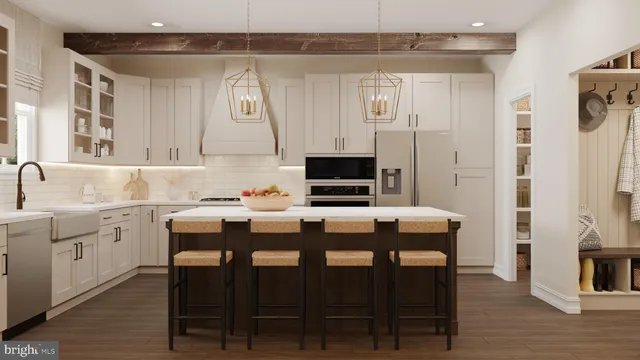 a kitchen with stainless steel appliances granite countertop a sink and a refrigerator