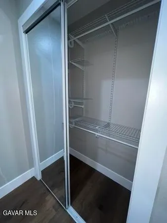 a white toilet sitting in a bathroom