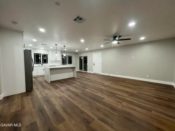 a empty room with wooden floor