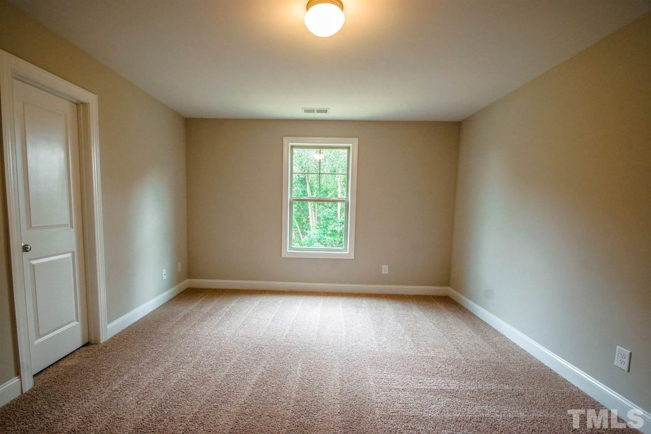1216 Silver Farm Road Raleigh, NC 27603 - Photo 15 of 25 a view of room with window and stairs
