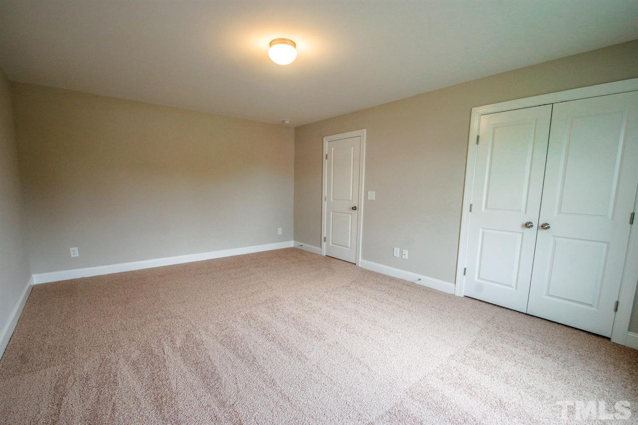 1216 Silver Farm Road Raleigh, NC 27603 - Photo 19 of 25 a view of an empty room and a window