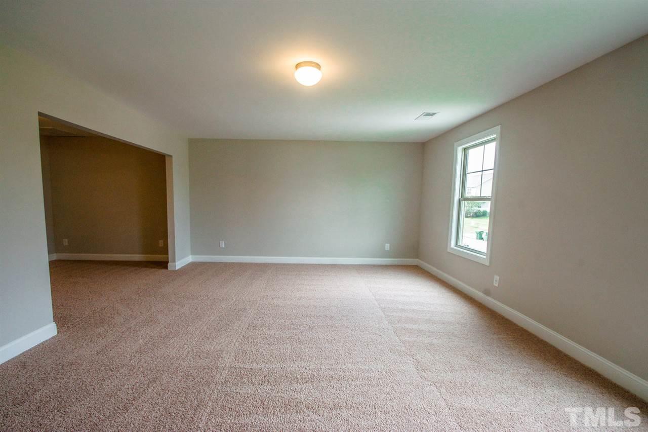 1216 Silver Farm Road Raleigh, NC 27603 - Photo 10 of 25 an empty room with windows