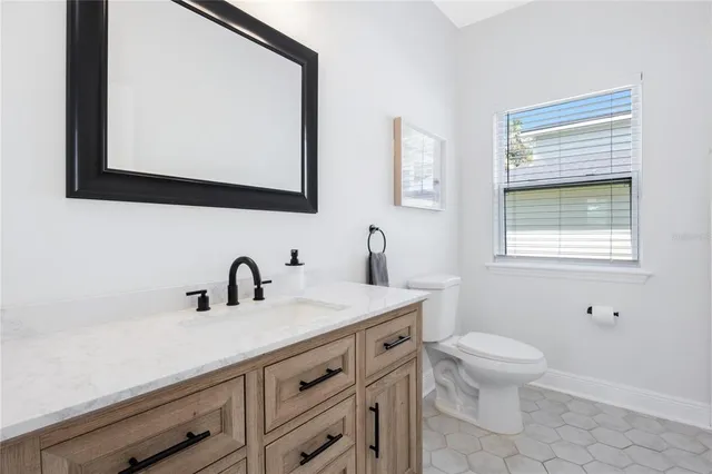 a kitchen with stainless steel appliances a refrigerator sink and microwave