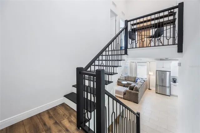 a room with a window and a dresser