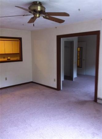 176 Swanson Road, Unit 312 Boxborough, MA 01719 - Photo 7 of 17 a view of a livingroom with a ceiling fan and window