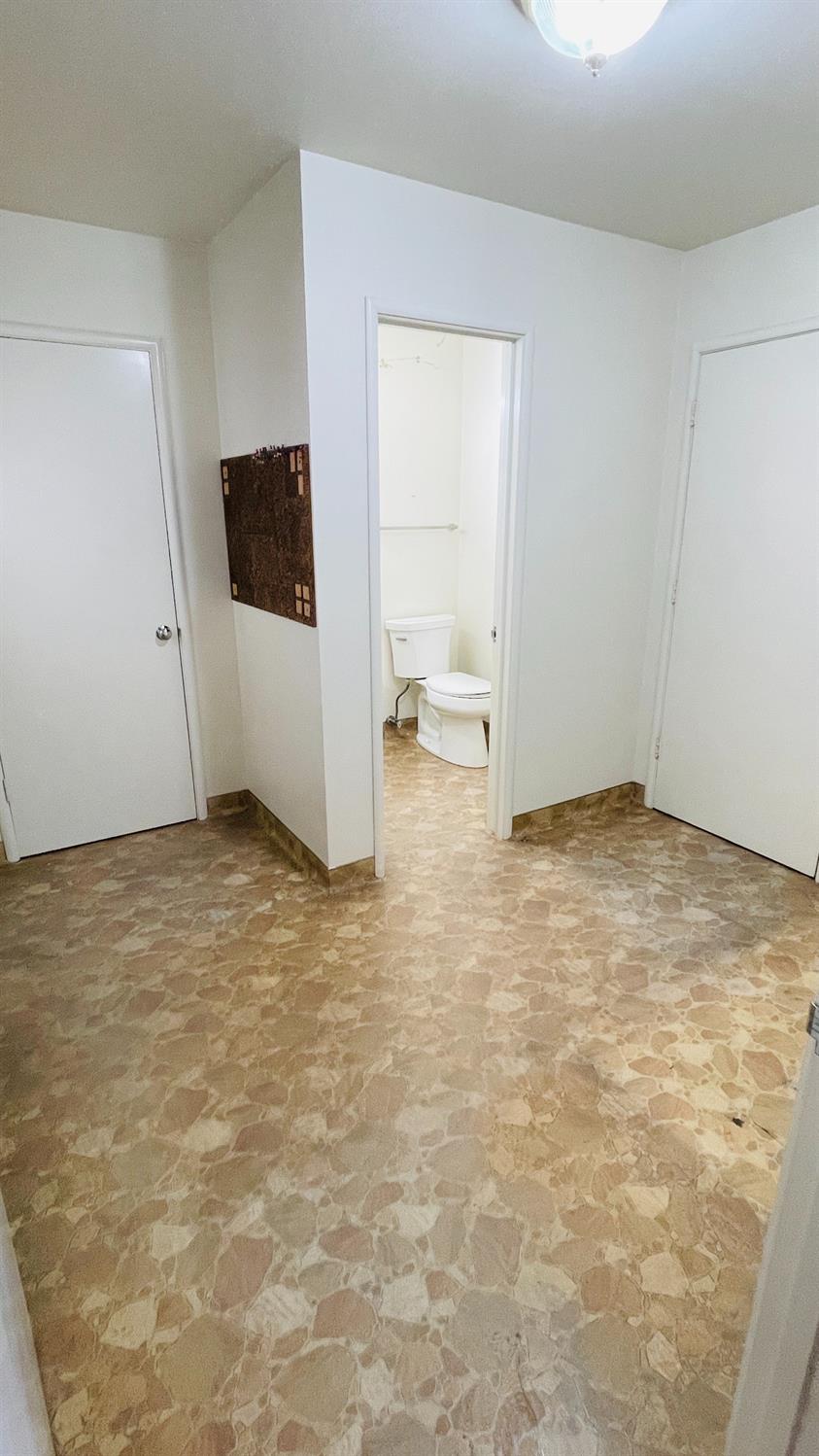 712 Leytonstone Avenue Modesto, CA 95355 - Photo 19 of 32 Large indoor laundry room iwth more built-in storage, half bath and access to the pool.