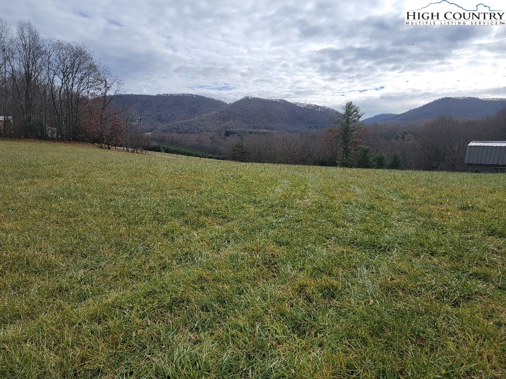 Golf Course Road, Unit 1A Sparta, NC 28675 - Photo 1 of 8 a view of an outdoor space and a yard