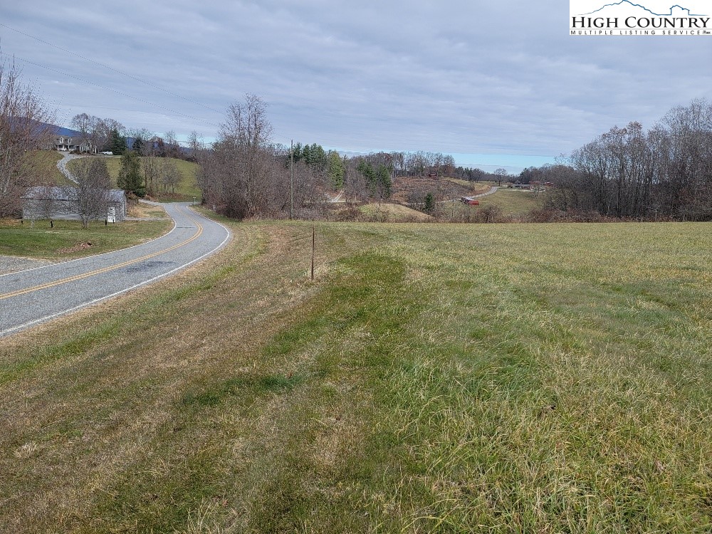 Golf Course Road, Unit 1A Sparta, NC 28675 - Photo 2 of 8 a view of a field with an trees