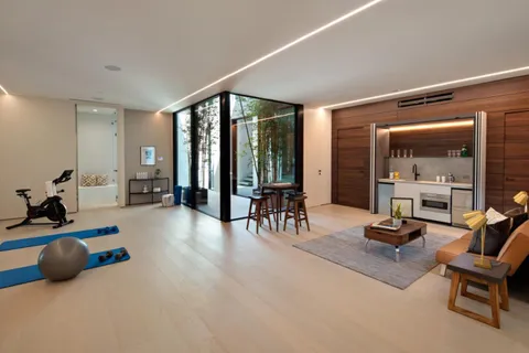 a room with gym equipment and a large window