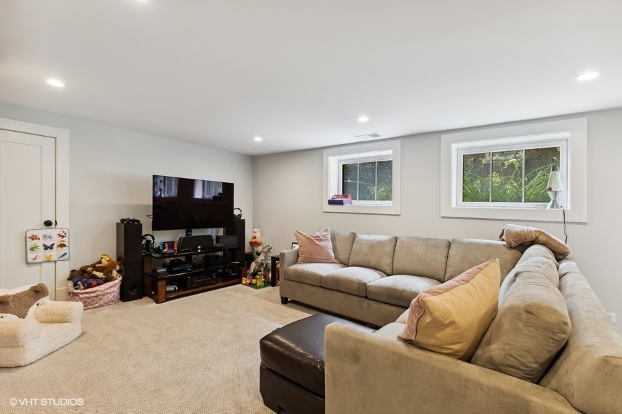 2236 Wesley Avenue Evanston, IL 60201 - Photo 13 of 25 a living room with furniture and a flat screen tv
