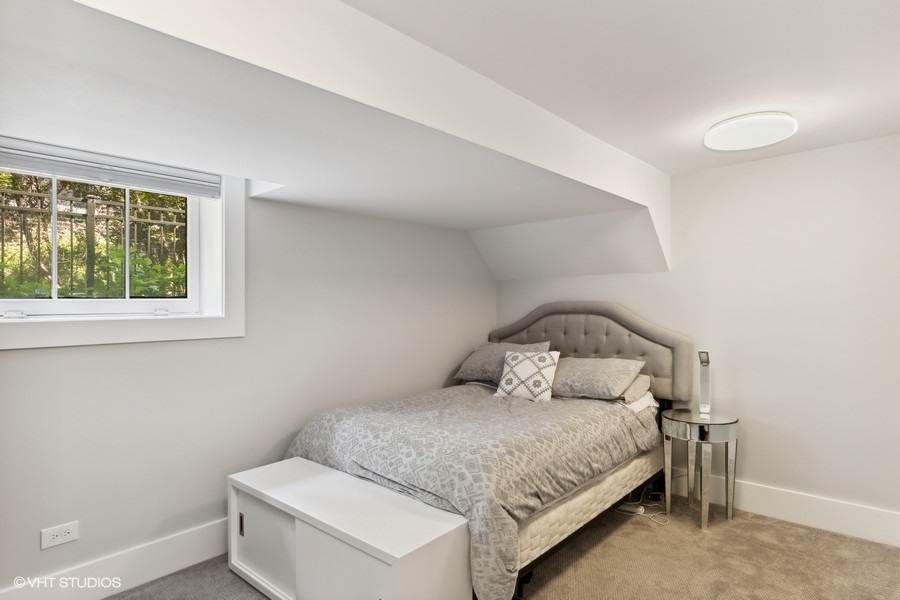 2236 Wesley Avenue Evanston, IL 60201 - Photo 15 of 25 a bedroom with a bed and window