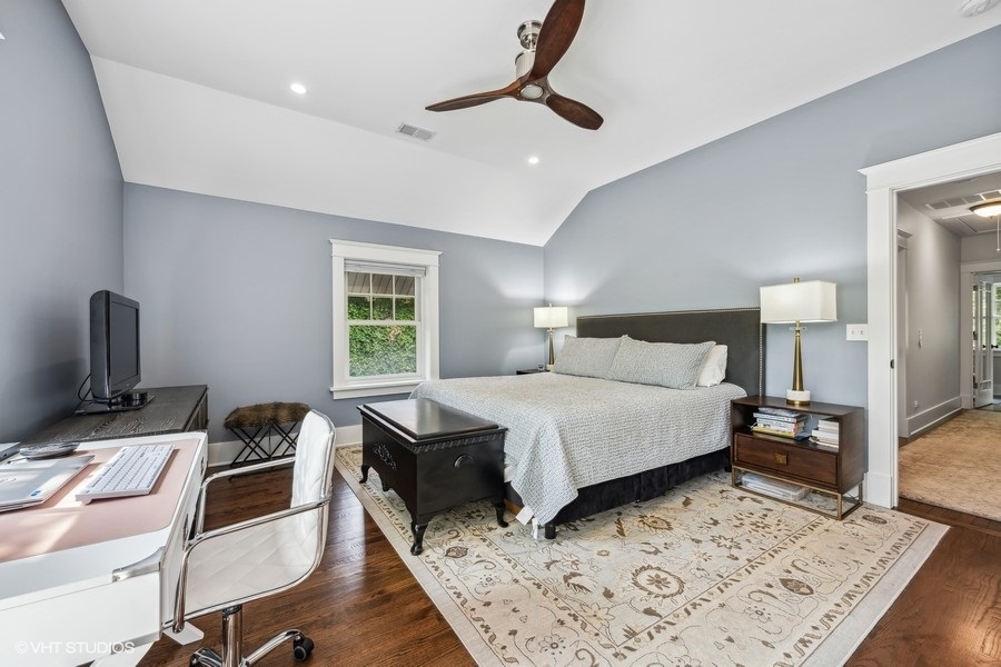 2236 Wesley Avenue Evanston, IL 60201 - Photo 18 of 25 a bedroom with a bed a desk and chair