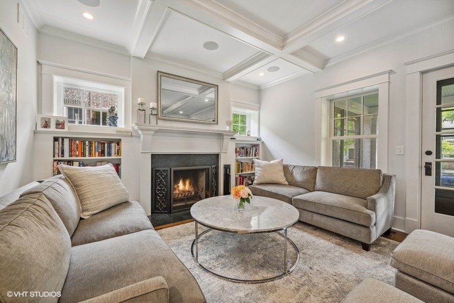 2236 Wesley Avenue Evanston, IL 60201 - Photo 3 of 25 a living room with furniture and a fireplace