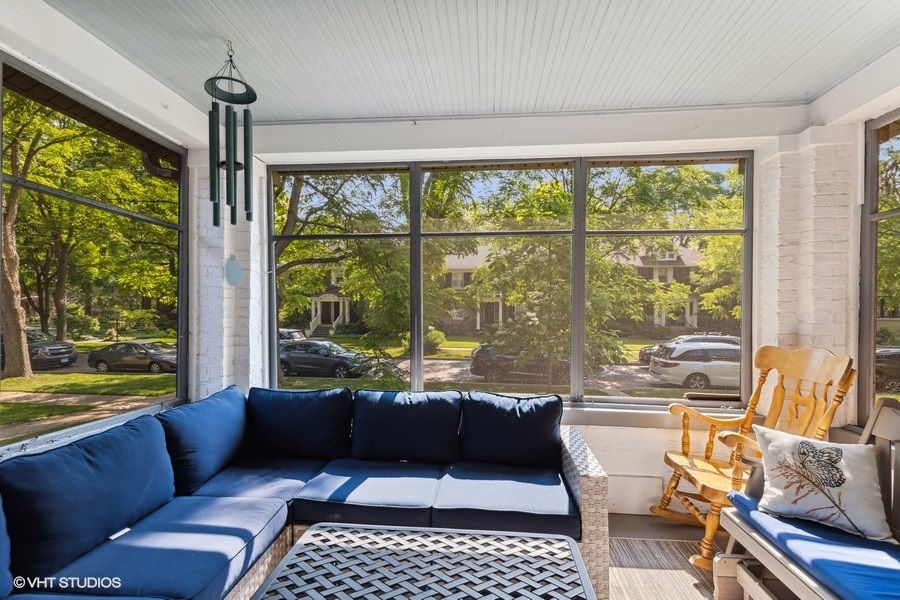 2236 Wesley Avenue Evanston, IL 60201 - Photo 6 of 25 a living room with furniture and a floor to ceiling window