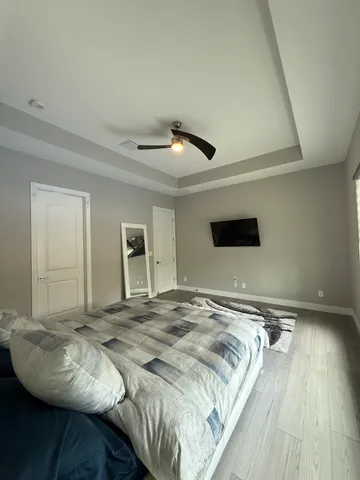 a bedroom with bed and window