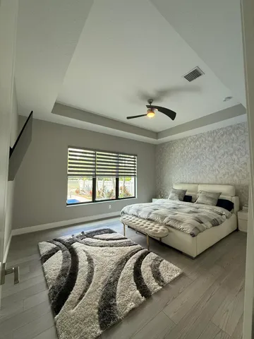 a room with a bed and a dresser