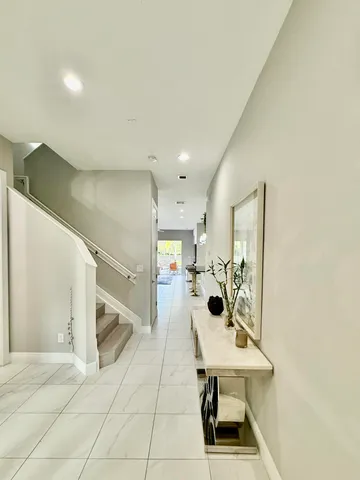 a view of a hallway with seating area