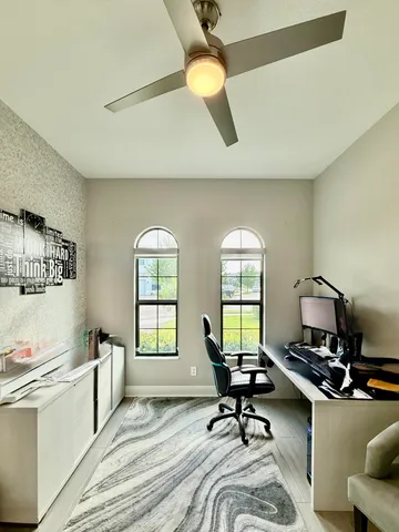 a bed sitting in a room next to a window
