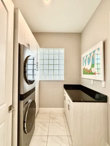 a kitchen with a stove top oven and cabinets