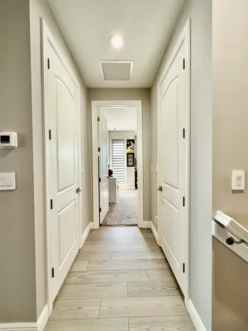 a bathroom with double vanity sinks and a mirror