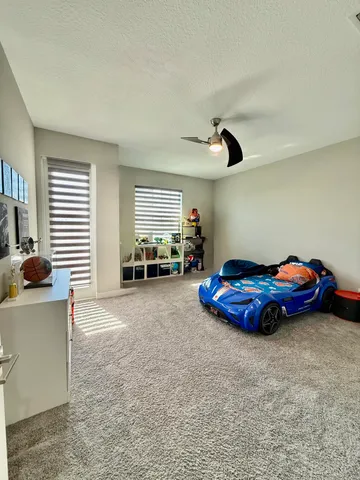 a bathroom with a double vanity sink toilet mirror and shower