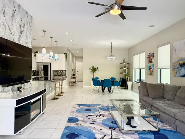 a living room with furniture fireplace and flat screen tv