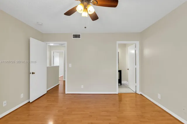 a bathroom with a sink vanity and toilet