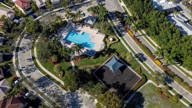 a small pool with lots of green space and fog
