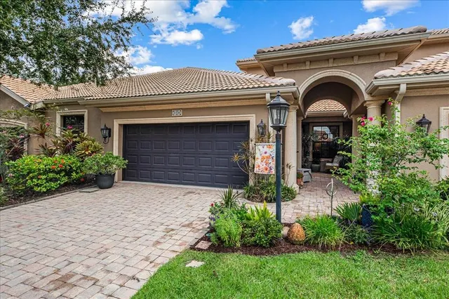 a view of balcony with furniture and umbrella