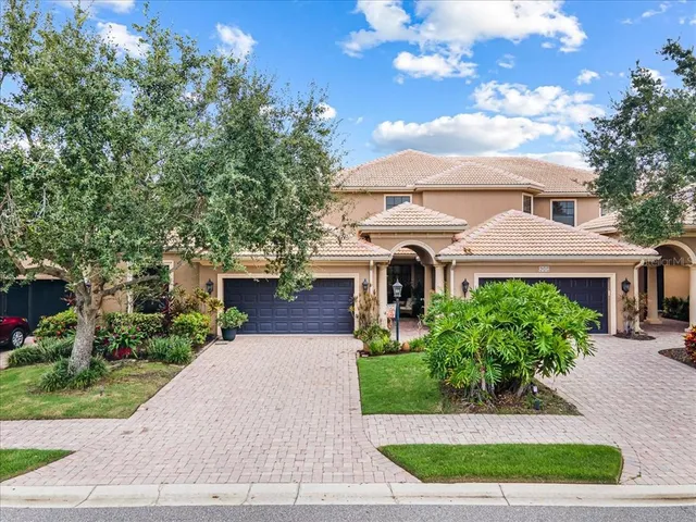 a view of a patio with table and chairs under an umbrella
