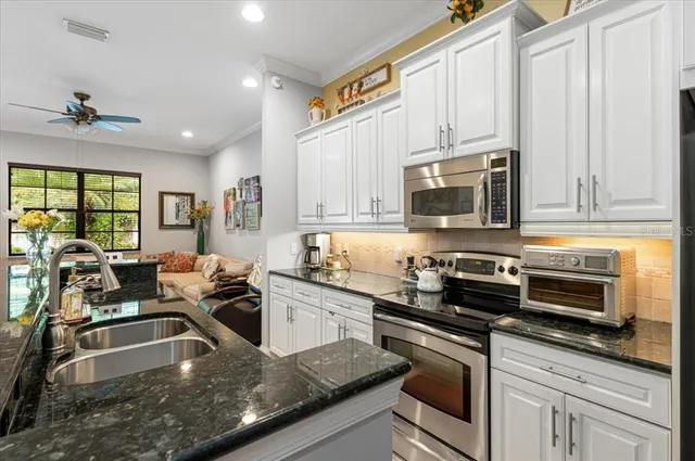 a bathroom with a tub sink mirror and a shower