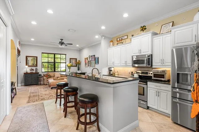 an aerial view of a house with a garden and swimming pool