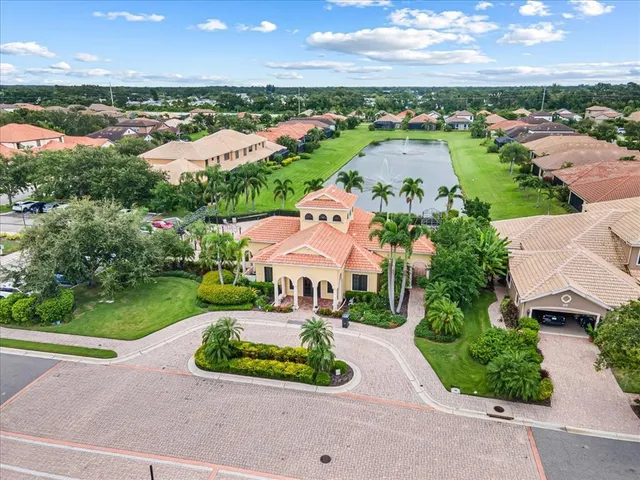 a view of a backyard with table and chairs and a fire pit