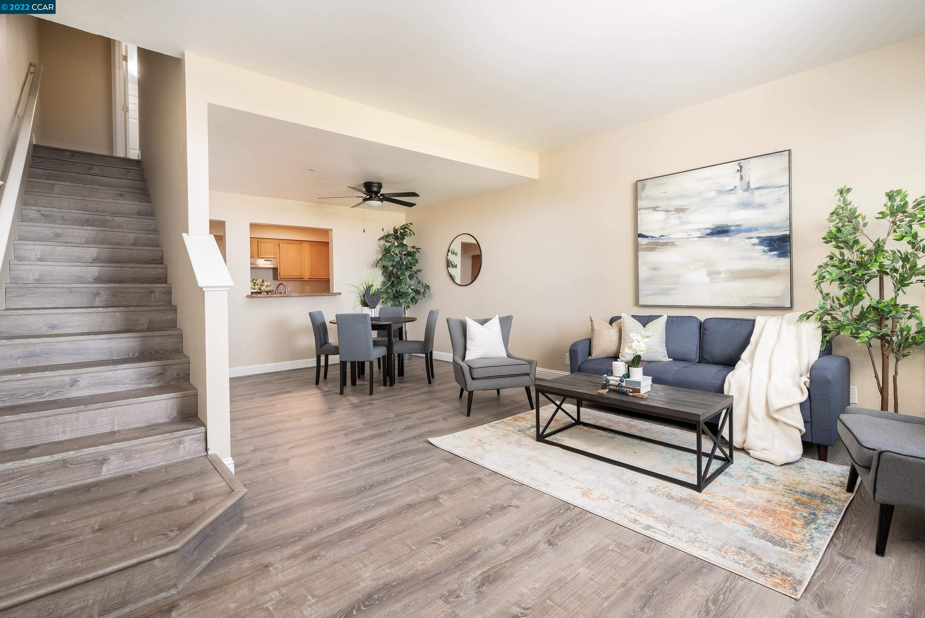 3463 Wells Road Oakley, CA 94561 - Photo 1 of 1 a living room with furniture and wooden floor