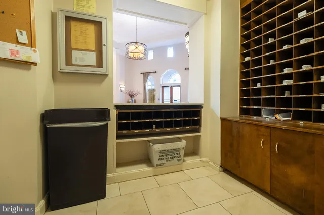 a kitchen with a refrigerator and a cabinets