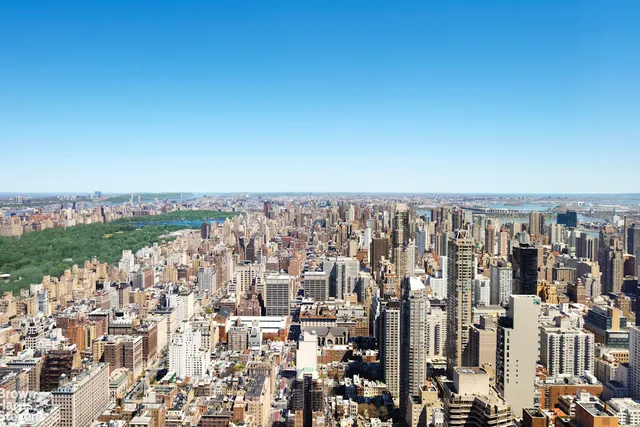 a living room with furniture and a lamp