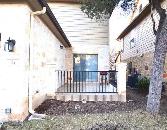 a view of a porch with a small yard