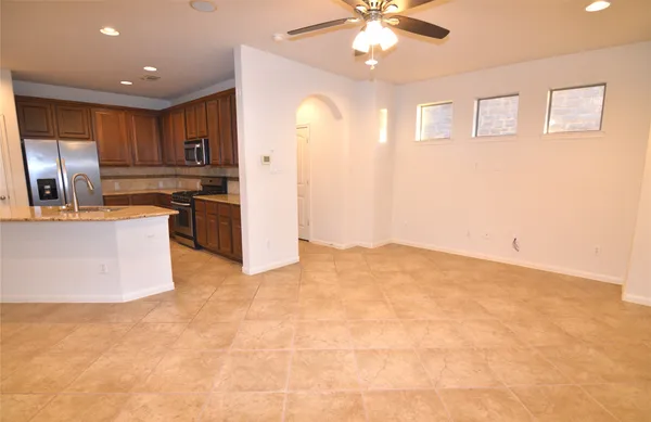 a view of a swimming pool with a patio