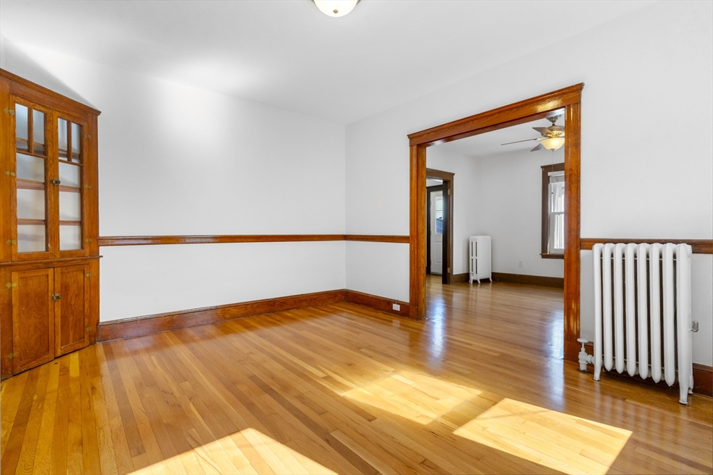 36 Turner Street, Unit 2 Boston, MA 02135 - Photo 16 of 31 a view of an empty room with wooden floor and a window
