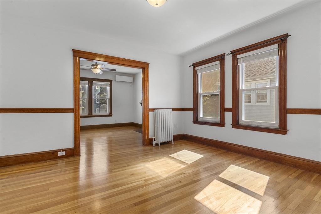 36 Turner Street, Unit 2 Boston, MA 02135 - Photo 17 of 31 a view of an empty room with wooden floor and a window