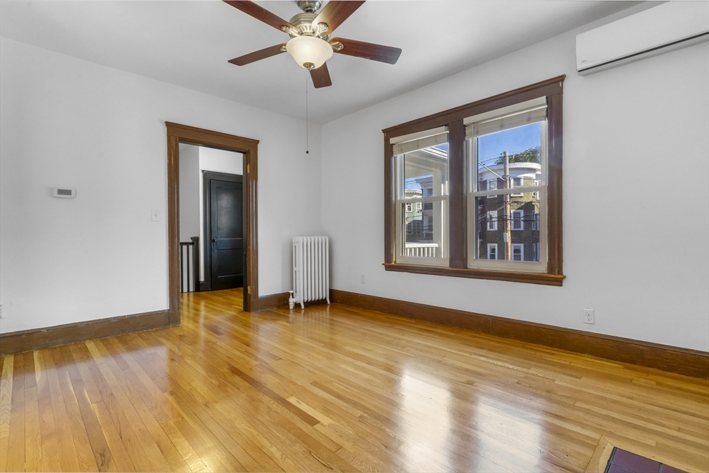 36 Turner Street, Unit 2 Boston, MA 02135 - Photo 20 of 31 a view of an empty room with window and wooden floor