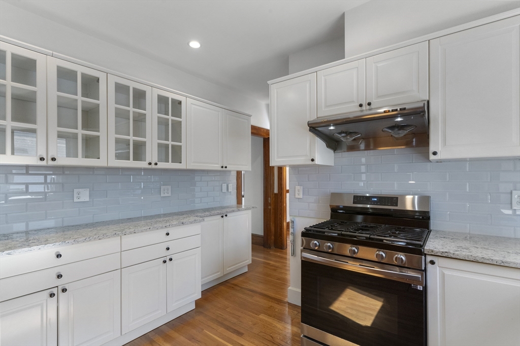 36 Turner Street, Unit 2 Boston, MA 02135 - Photo 3 of 31 a kitchen with stainless steel appliances granite countertop a stove and a sink